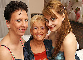 Three old and young lesbians make out